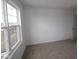 Neutral bedroom with a window and door at 17026 Cowbell Dr, Noblesville, IN 46060