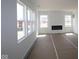 Spacious living room with a modern electric fireplace and an abundance of natural light at 17026 Cowbell Dr, Noblesville, IN 46060