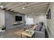Spacious basement featuring a comfortable seating area with a large sectional sofa at 1750 W Stop 11 Rd, Indianapolis, IN 46217