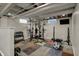 Well-equipped basement gym featuring weightlifting equipment and varied exercise machines at 1750 W Stop 11 Rd, Indianapolis, IN 46217