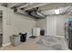Spacious unfinished basement area featuring laundry area, storage, and room for recreation at 1750 W Stop 11 Rd, Indianapolis, IN 46217