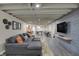 Finished basement with a large TV, sectional, and pool table at 1750 W Stop 11 Rd, Indianapolis, IN 46217