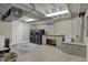 Basement laundry room equipped with modern washer, dryer, and ample counter space at 1750 W Stop 11 Rd, Indianapolis, IN 46217