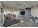 Finished basement with a large TV, sectional, and pool table at 1750 W Stop 11 Rd, Indianapolis, IN 46217