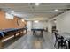 Finished basement featuring a game room with pool table, ping pong table, and recreational area at 1750 W Stop 11 Rd, Indianapolis, IN 46217