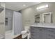 Bathroom features a tiled shower, toilet, and vanity at 1750 W Stop 11 Rd, Indianapolis, IN 46217