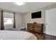 Bedroom with closet and mounted TV at 1750 W Stop 11 Rd, Indianapolis, IN 46217