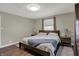 This bedroom features a queen bed, wood flooring, and neutral paint at 1750 W Stop 11 Rd, Indianapolis, IN 46217
