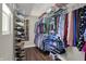 Walk-in closet with shelving and rod for clothes at 1750 W Stop 11 Rd, Indianapolis, IN 46217