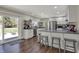 Modern kitchen with stainless steel appliances, white cabinets, and a convenient breakfast bar area at 1750 W Stop 11 Rd, Indianapolis, IN 46217