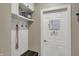 Mud room with storage bench, hooks, and a white door provides convenient organization at 1750 W Stop 11 Rd, Indianapolis, IN 46217