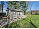 A backyard shed with a gray exterior, perfect for extra storage at 1750 W Stop 11 Rd, Indianapolis, IN 46217