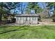 Backyard shed with double doors and windows, offering extra storage space at 1750 W Stop 11 Rd, Indianapolis, IN 46217