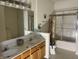 Bathroom featuring double sinks, ample counter space, and a separate shower and tub at 18346 Piers End Dr, Noblesville, IN 46062