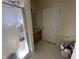 Bathroom with glass shower door, linoleum flooring and a white door at 18346 Piers End Dr, Noblesville, IN 46062