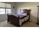 Bedroom with a large window and a comfortable bed, creating a peaceful retreat at 18346 Piers End Dr, Noblesville, IN 46062