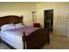 Inviting bedroom with a classic bed, large window, and a glimpse into the en-suite bathroom at 18346 Piers End Dr, Noblesville, IN 46062