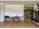Light-filled dining room adjacent to the kitchen features hardwood floors and classic furniture at 18346 Piers End Dr, Noblesville, IN 46062