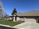 Charming brick home featuring an attached garage and a well-manicured lawn at 18346 Piers End Dr, Noblesville, IN 46062