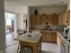 Open kitchen with an island, cabinets, and an adjacent dining area, great for entertaining at 18346 Piers End Dr, Noblesville, IN 46062
