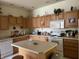 Bright kitchen with a large island, white appliances, and plenty of counter space at 18346 Piers End Dr, Noblesville, IN 46062