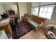 Home office with woven furniture, area rug and bright light from a large window at 18346 Piers End Dr, Noblesville, IN 46062