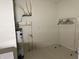 Utility room with hot water heater and clothes hanging rack at 18346 Piers End Dr, Noblesville, IN 46062