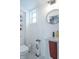Well-lit bathroom featuring a modern sink, toilet, and shelving at 1838 Applegate St, Indianapolis, IN 46203