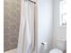 Bathroom features unique hexagonal tile surround in tub with a shower at 1838 Applegate St, Indianapolis, IN 46203