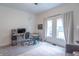 Bright bedroom with modern desk and natural light from the large windows at 1838 Applegate St, Indianapolis, IN 46203