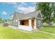 Well-maintained two-story home with a charming front porch and landscaped yard at 1838 Applegate St, Indianapolis, IN 46203