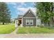 Charming single-Gathering home with a well-manicured lawn and inviting front porch at 1838 Applegate St, Indianapolis, IN 46203