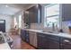 Stylish kitchen showcasing modern appliances, ample counter space, and dark wood cabinetry at 1838 Applegate St, Indianapolis, IN 46203