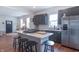 Contemporary kitchen with a central island, stainless appliances, and an open layout to living area at 1838 Applegate St, Indianapolis, IN 46203