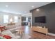 Spacious living room featuring wood floors, modern furnishings, and an open floor plan at 1838 Applegate St, Indianapolis, IN 46203