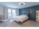 Serene main bedroom featuring neutral decor, decorative wall accents, and ample natural light at 1838 Applegate St, Indianapolis, IN 46203