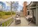 Spacious back deck with seating area, grill and serene backyard views at 206 Somerville Rd, Anderson, IN 46011