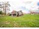 Large yard, showcasing the deck and rear of the house at 206 Somerville Rd, Anderson, IN 46011