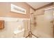 Bathroom featuring updated fixtures and a tiled shower with neutral-toned decor at 206 Somerville Rd, Anderson, IN 46011