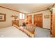 Comfortable bedroom with hardwood accents, a built-in bookshelf, and soft blue carpet at 206 Somerville Rd, Anderson, IN 46011