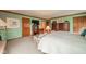 Spacious bedroom featuring neutral carpeting, decorative wood trim and furnishings at 206 Somerville Rd, Anderson, IN 46011