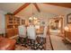 Open dining area with wooden beams and a view into the living area at 206 Somerville Rd, Anderson, IN 46011