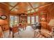 Bright home office with wood paneling and trim, lots of windows, and custom built-ins at 206 Somerville Rd, Anderson, IN 46011