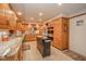 Spacious kitchen features granite counters, stainless steel appliances, and custom wood cabinetry at 206 Somerville Rd, Anderson, IN 46011