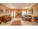 Inviting living room featuring a brick fireplace and two plush leather sofas at 206 Somerville Rd, Anderson, IN 46011