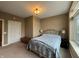 A comfortable bedroom with a window for natural light, as well as a cozy bed at 20971 Shoreline Ct # 214, Noblesville, IN 46062