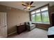 A cozy bedroom with a chair for reading, as well as a nice outside view at 20971 Shoreline Ct # 214, Noblesville, IN 46062