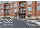 A well-maintained brick building with black awning entrance and balconies at 20971 Shoreline Ct # 214, Noblesville, IN 46062