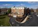 Exterior view of a multi-story brick apartment building with balconies and landscaped grounds at 20971 Shoreline Ct # 214, Noblesville, IN 46062