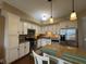 The updated kitchen features granite countertops, a stainless steel fridge, and ample cabinet space at 20971 Shoreline Ct # 214, Noblesville, IN 46062